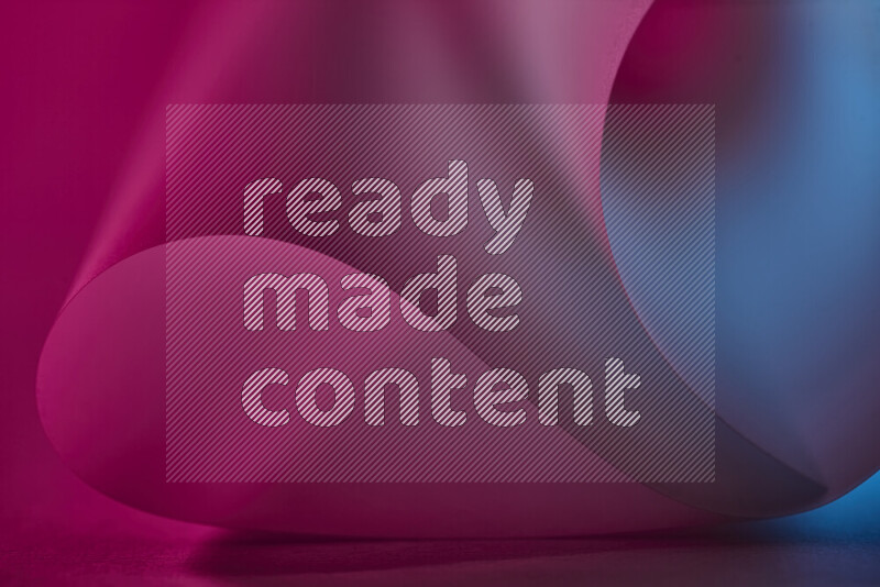 An abstract art piece displaying smooth curves in blue and pink gradients created by colored light