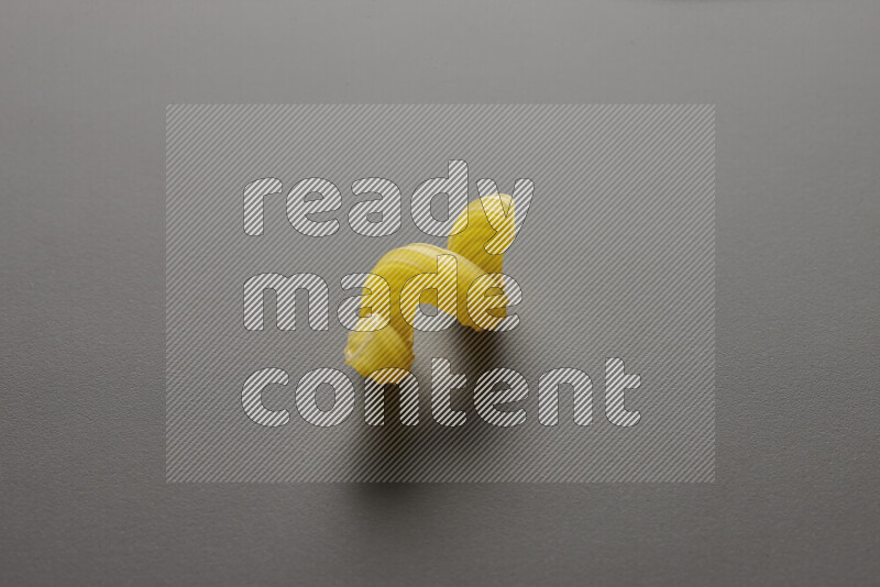 Twist pasta on grey background