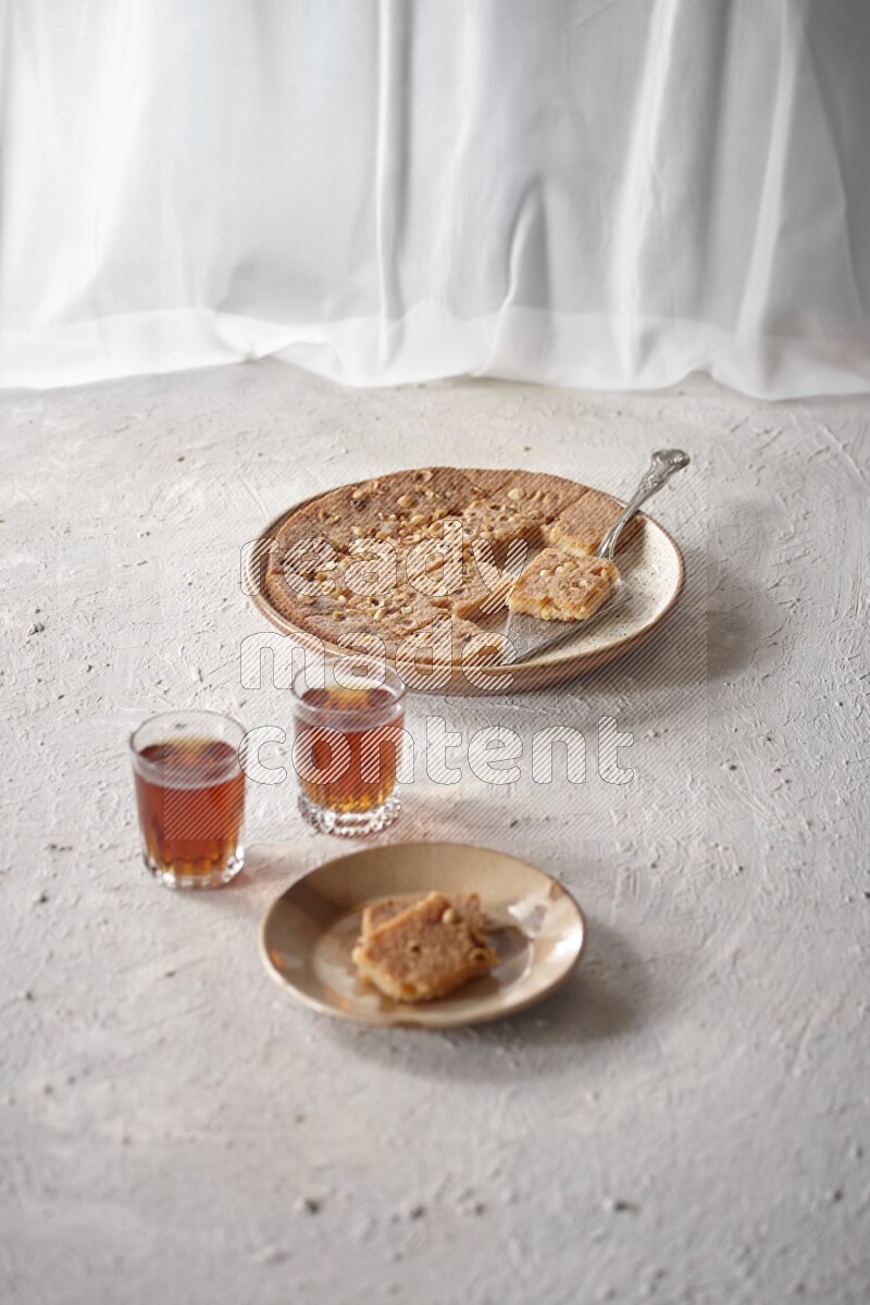 Basbousa with tea in a light setup
