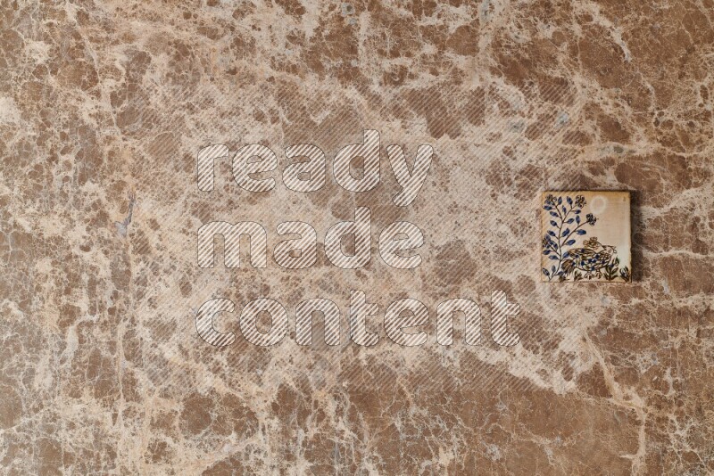 A decorative coaster on beige marble background