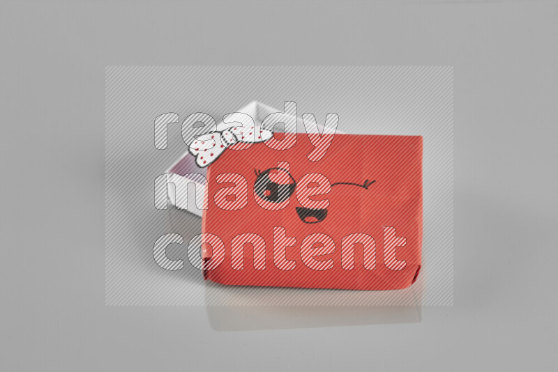 Origami gift box on grey background