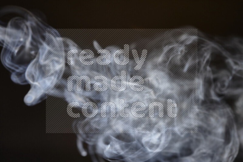 Motion of wavy smoke isolated on dark background