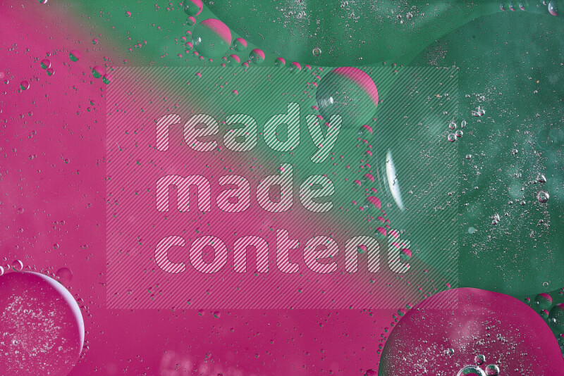 Close-ups of abstract oil bubbles on water surface in shades of green and pink
