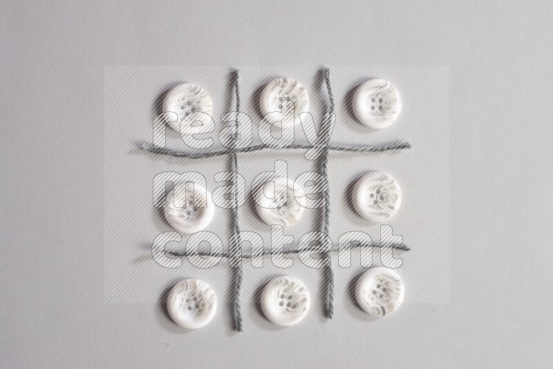 White buttons placed on grey background