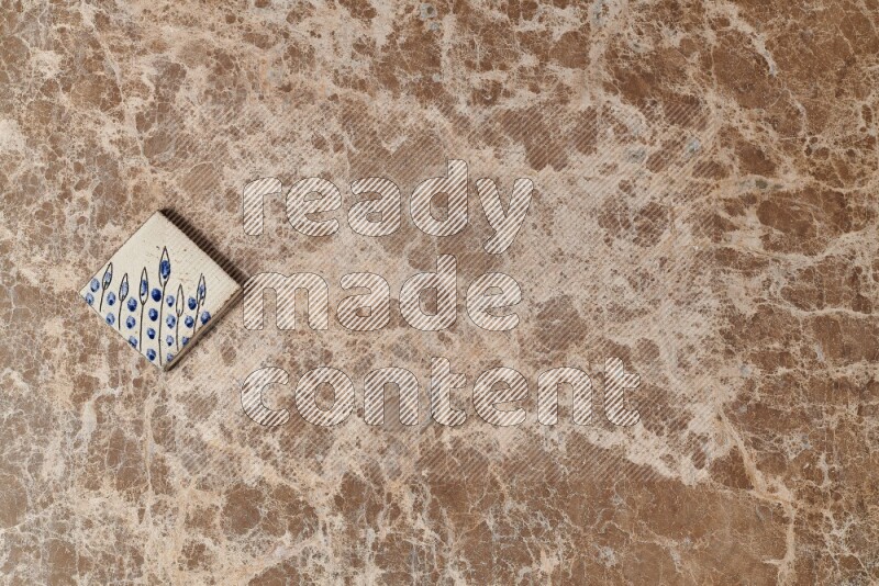 A decorative coaster on beige marble background