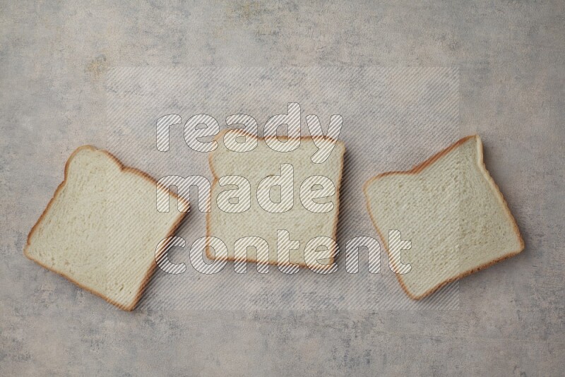 White Toast slices on alight blue textured background