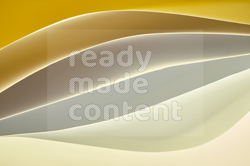 This image showcases an abstract paper art composition with paper curves in gold gradients created by colored light
