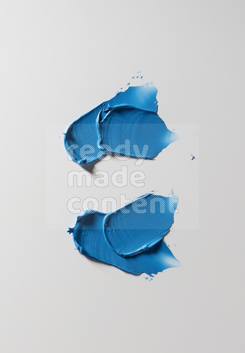 Blue painting knife strokes on white background