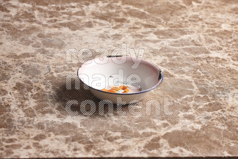 A vintage metal plate on beige marble background