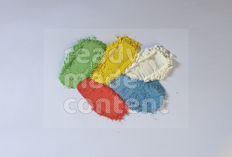 Multicolored powder smears on white background