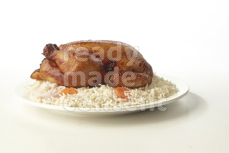 white  basmati Rice with  whole roasted chicken  on a white rounded plate direct on white background