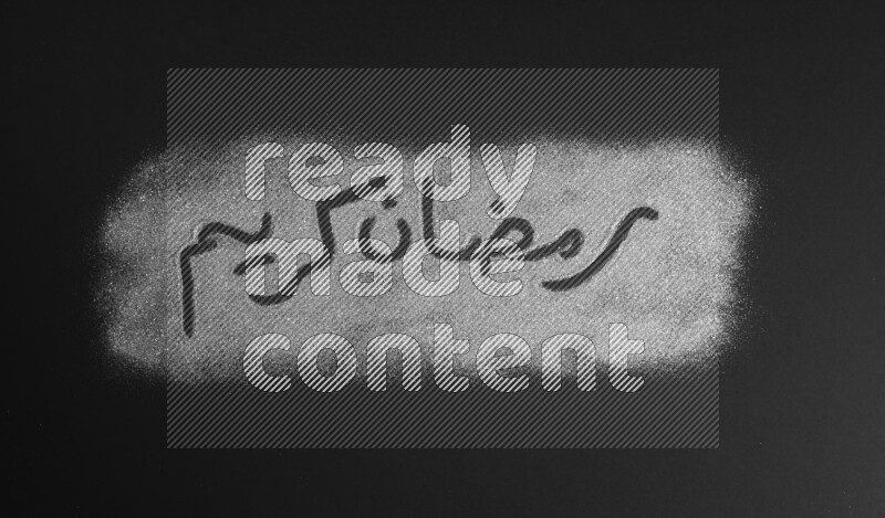 A sentence written with silver glitter on black background