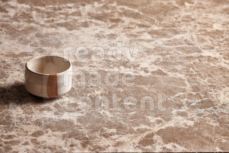 Multicolored Pottery Bowl on Beige Marble Flooring