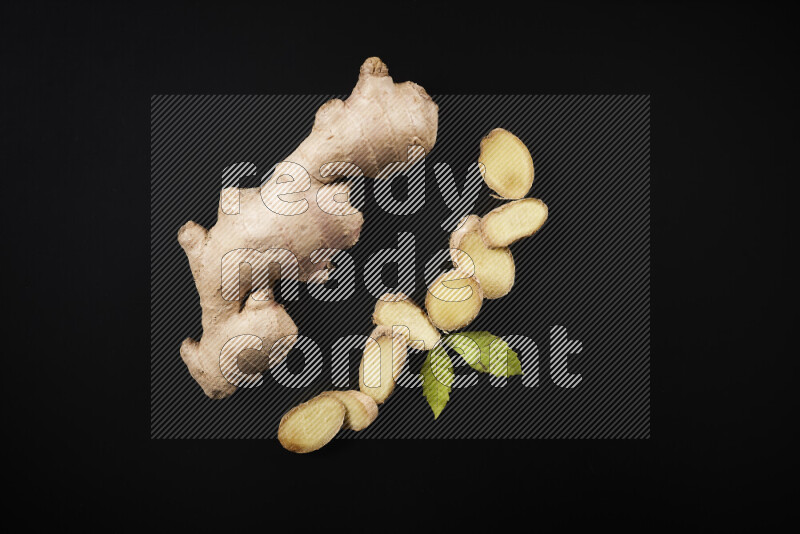 Fresh ginger root on black background