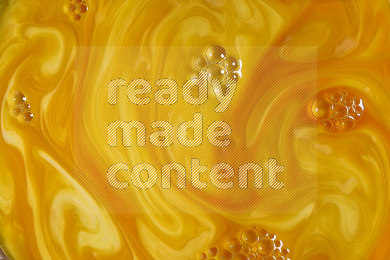 A close-up of abstract different swirling patterns in orange