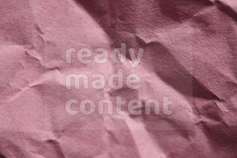 Crumpled craft paper on black background