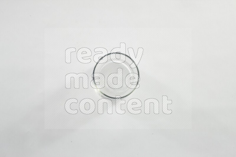 Glassware such as coffee pot, cup, saucer and jar on white background