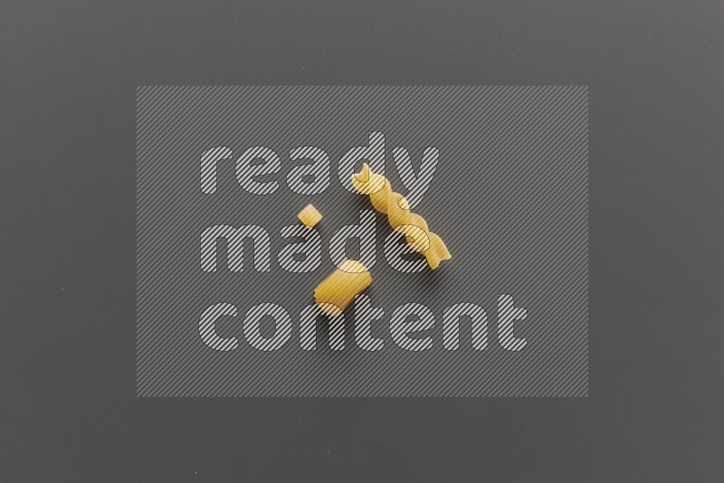Different pasta types on grey background