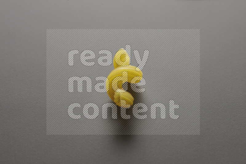 Twist pasta on grey background