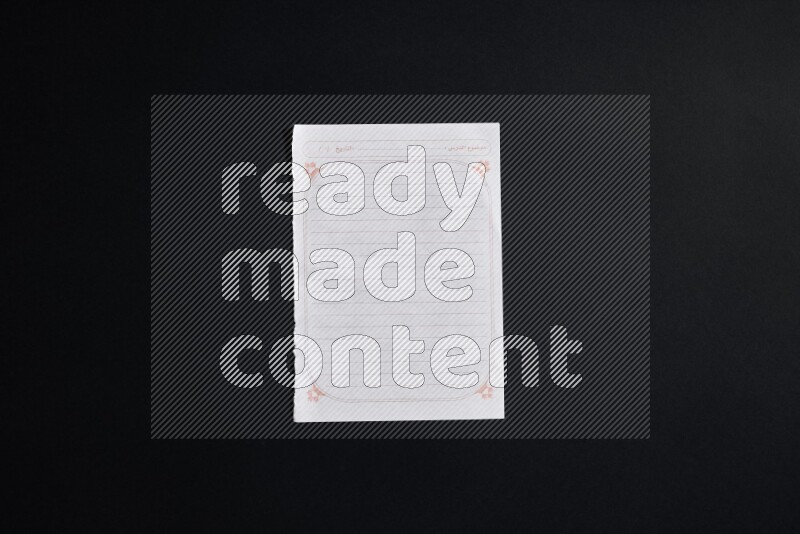 Notebook sheet on black background