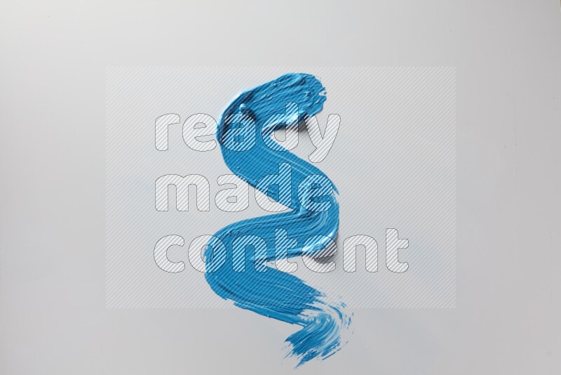 A single blue zigzag brush stroke on a white background