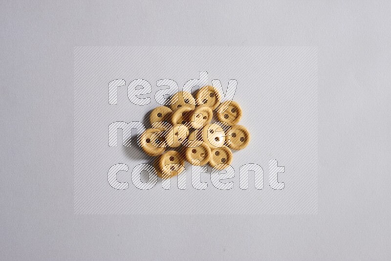 Wooden buttons placed on grey background