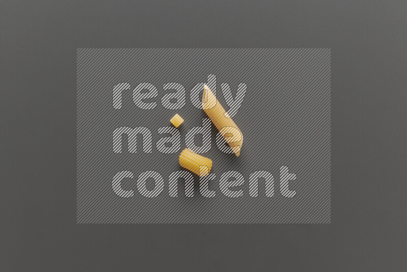 Different pasta types on grey background