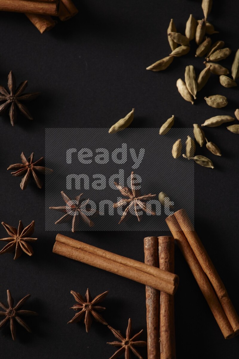 Cinnamon Sticks, Cardamom and star anise on a black background