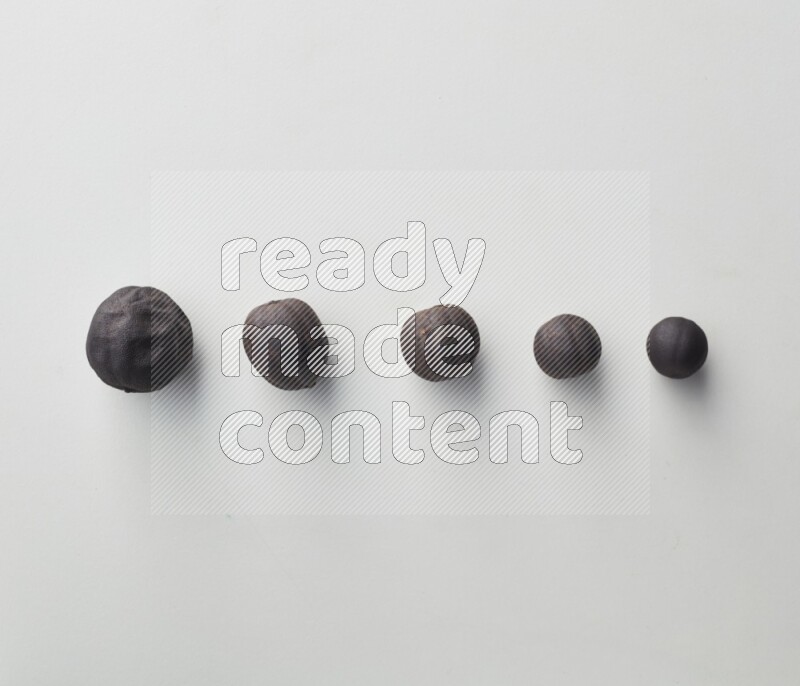 Top-view shot of dried lime (loomi) on white background