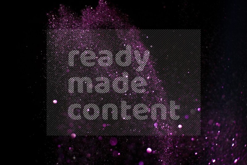 Pink glitter powder isolated on black background