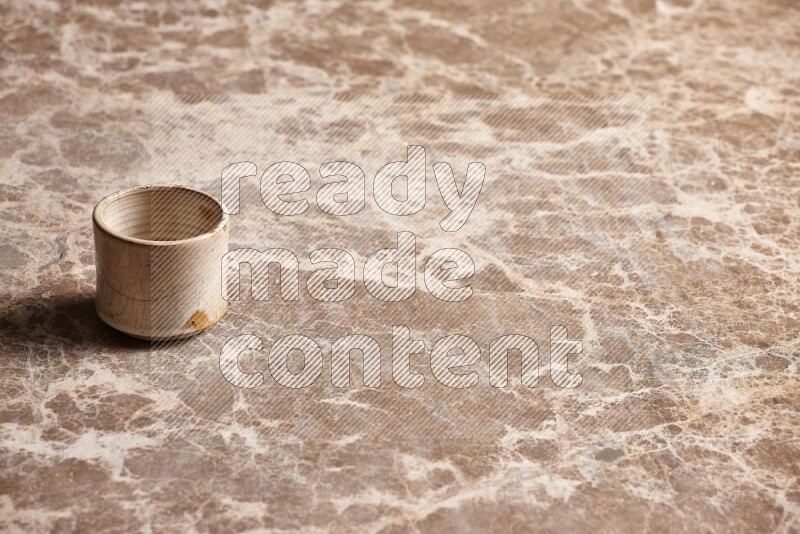 Pottery Cup on Beige Marble Flooring