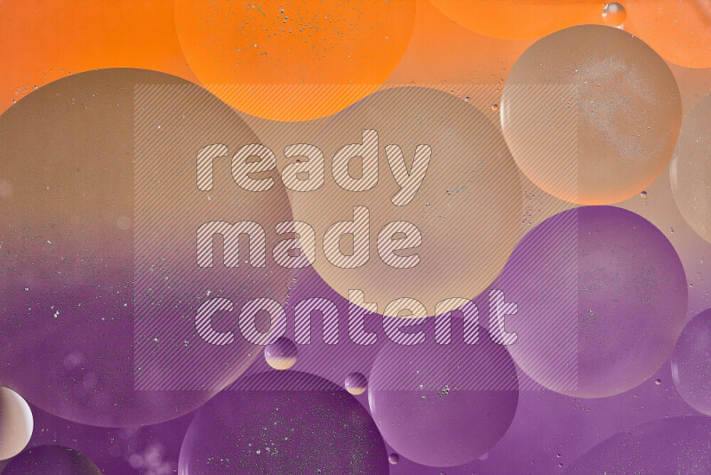 Close-ups of abstract oil bubbles on water surface in shades of brown, orange and purple