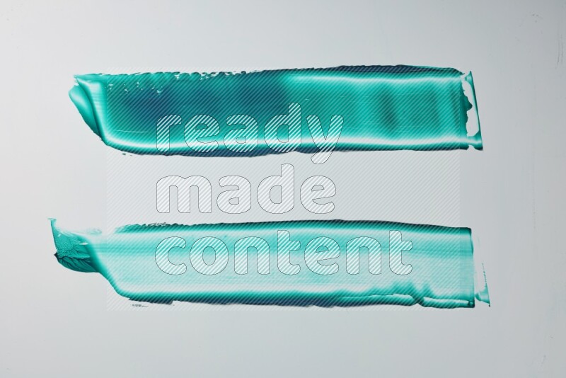 Turquoise painting knife strokes on white background