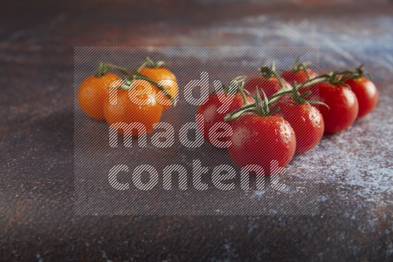 Mixed cherry tomato veins on a textured reddish rustic metal background 45 degree