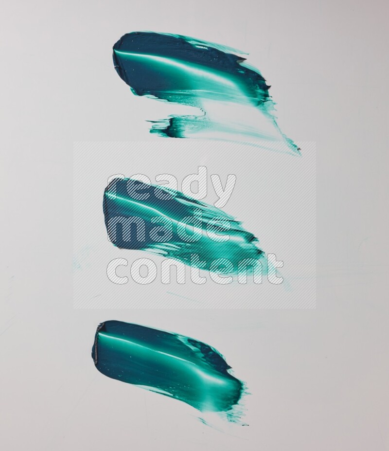 Turquoise painting knife strokes on white background