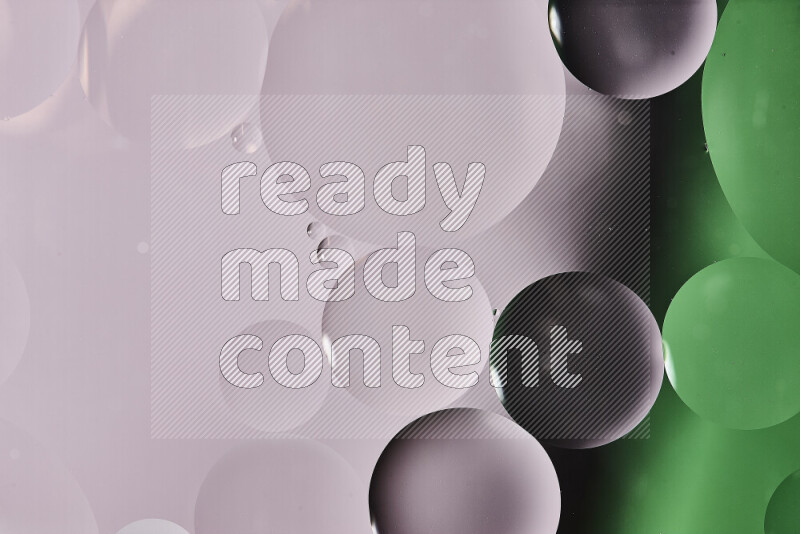 Close-ups of abstract oil bubbles on water surface in shades of white and green