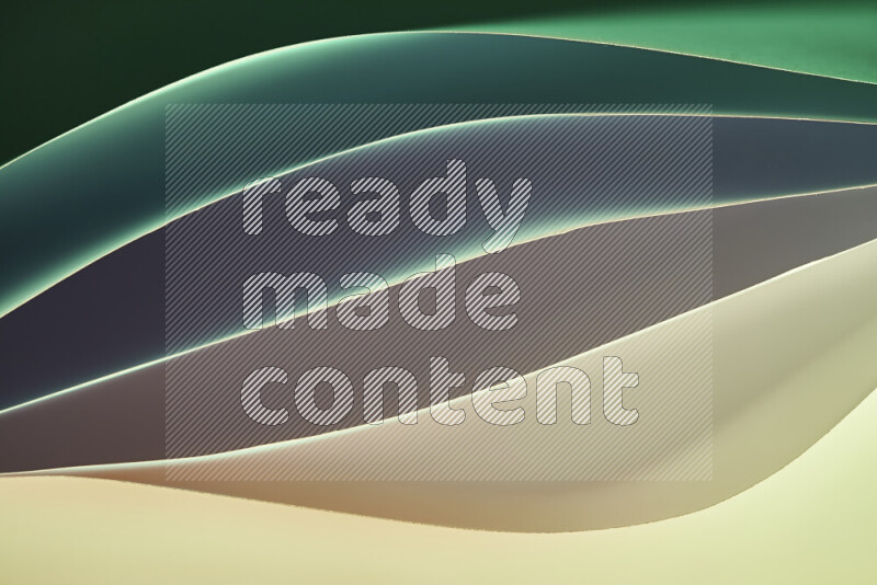 This image showcases an abstract paper art composition with paper curves in green and different warm gradients created by colored light