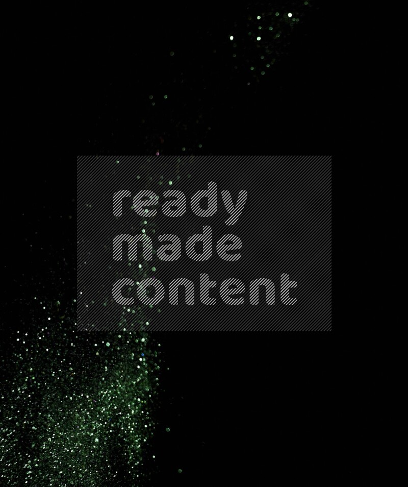 Green glitter powder isolated on black background