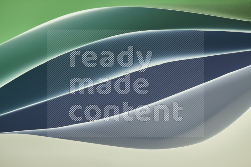 This image showcases an abstract paper art composition with paper curves in green gradients created by colored light