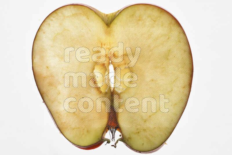 Apple slices on illuminated white background