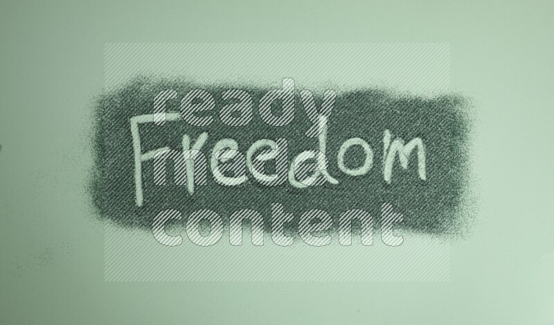 A word written with green glitter on green background