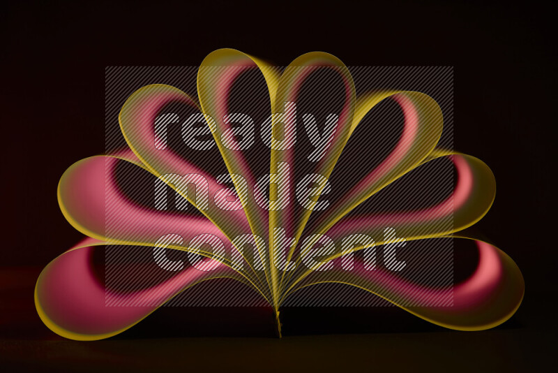 An abstract art piece displaying smooth curves in yellow and red gradients created by colored light