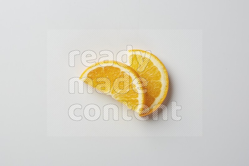 Two halves of an orange slices on white background
