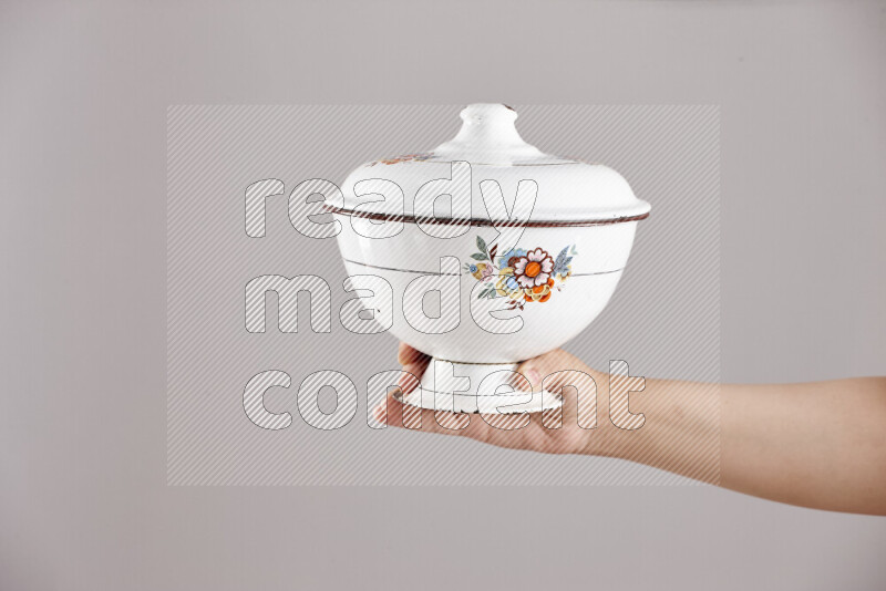Woman hands holding different metal essentials in different positions