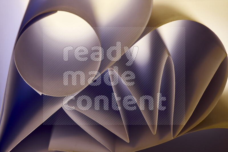 An artistic display of paper folds creating a harmonious blend of geometric shapes, highlighted by soft lighting in warm tones