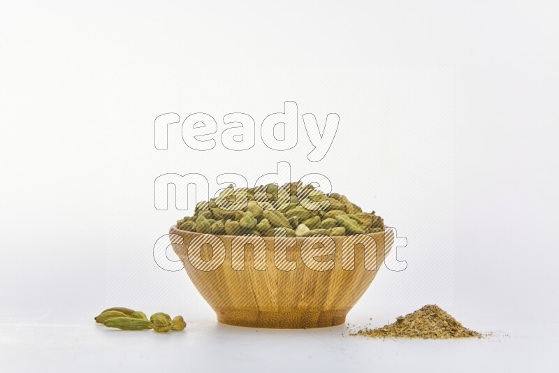 Cardamon in a container on white background