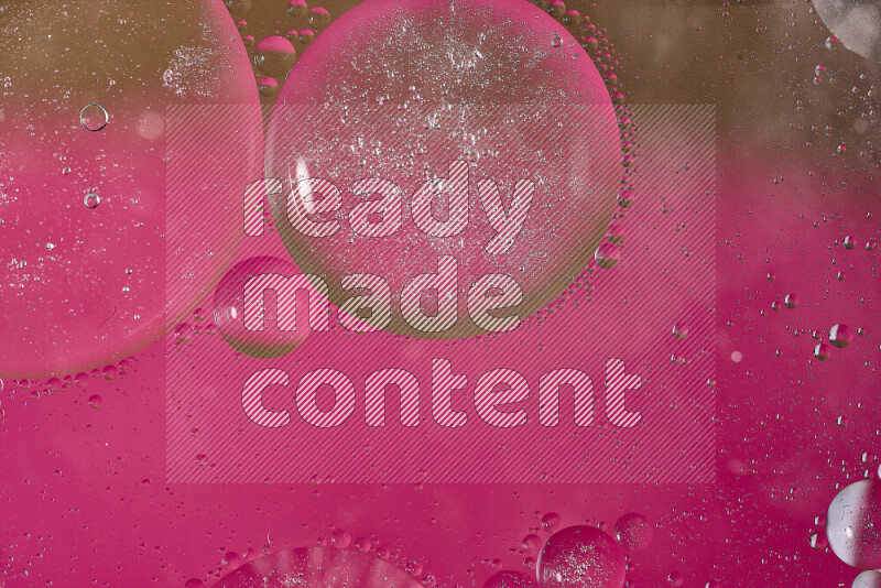 Close-ups of abstract oil bubbles on water surface in shades of pink and brown