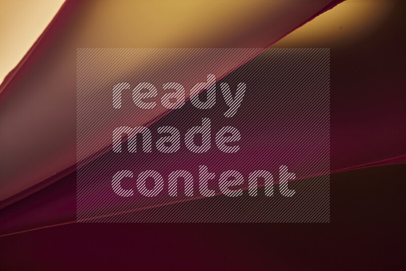 An abstract art piece displaying smooth curves in warm and cold gradients created by colored light