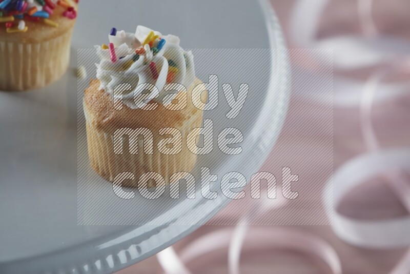 Vanilla mini cupcake topped with cream