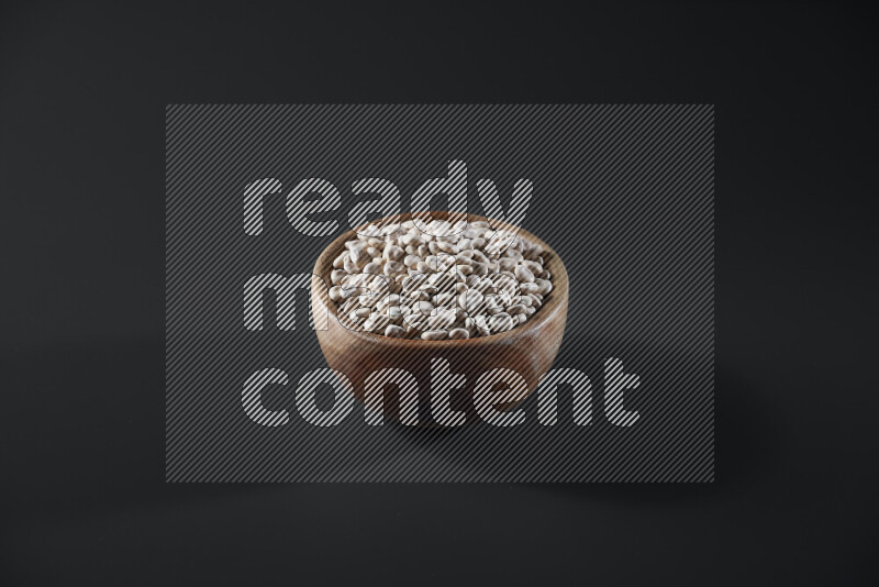 Lupin Beans in a wooden bowl on grey background